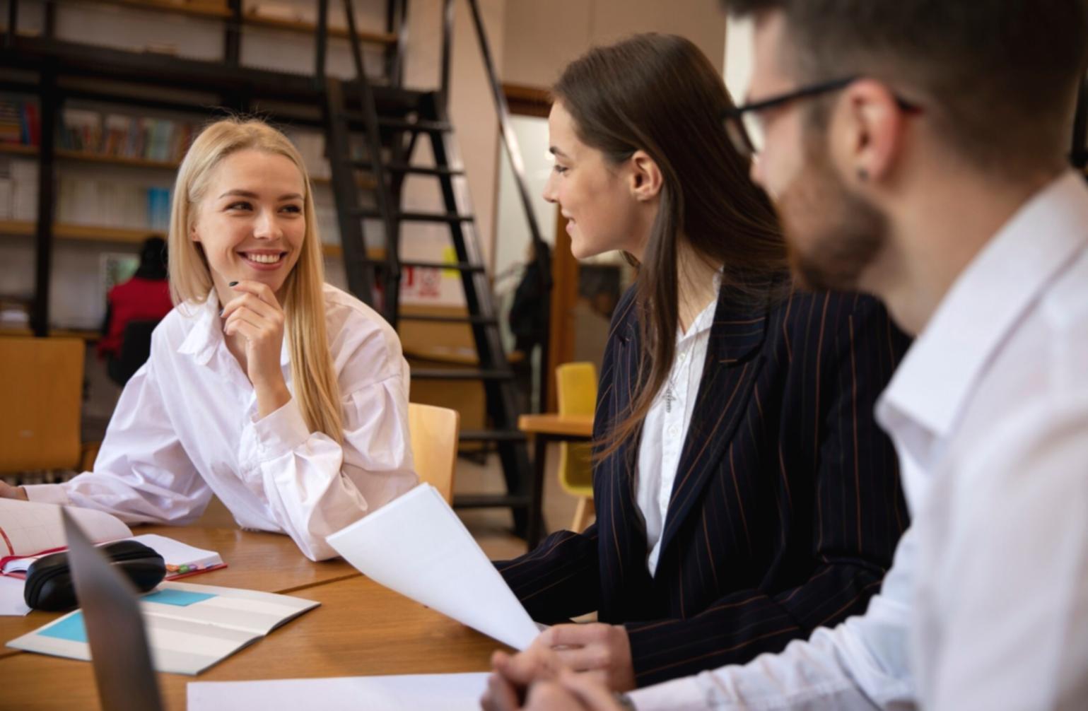 Business owner reviewing financial documents and budget planning materials on desk